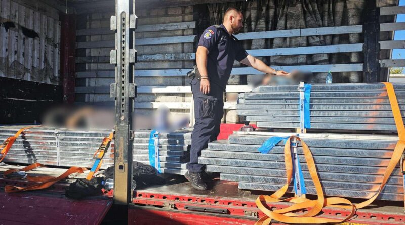 Two foreign citizens, discovered hiding in a semi-trailer